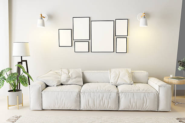 istock White wall living room with sofa and frame mockup, 3d rendering 2234675739