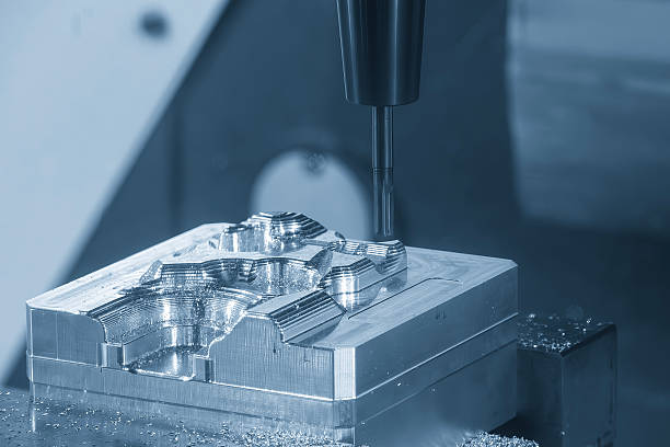 istock The 3-axis CNC milling machine cutting the mold part with solid flat nose end mill tool in the blue tone. 2234681955