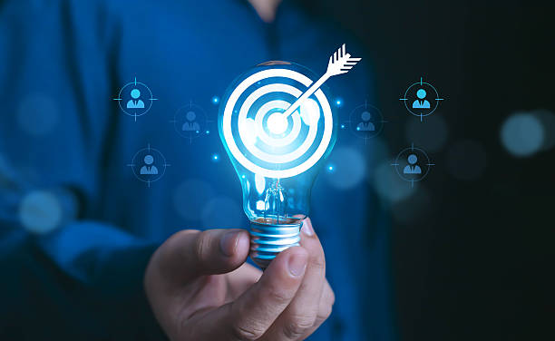 istock Hand holding light bulb with glowing target and dart arrow inside. Concept innovation, creative ideas, business goals, target marketing, and successful strategy planning customer group. Set business 2234683088