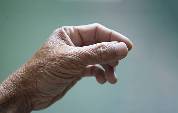 istock Close up of an old woman's hand on a blurred background. 2234687140