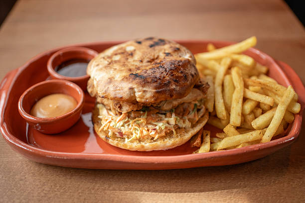 istock Scrumptious sandwich and crispy fries served on a rustic plate 2234688539