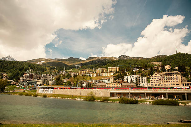 Private houses and hotels by the mountain lake. Arosa. Swiss Alps.