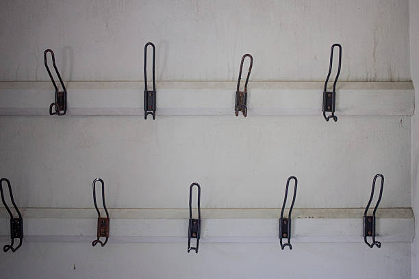 Row of old metal coat hooks