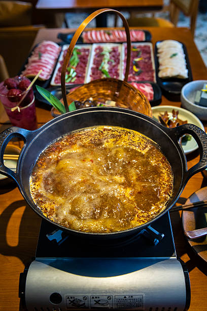 istock A table full of hot pot side dishes and boiling hot pot 2234697956