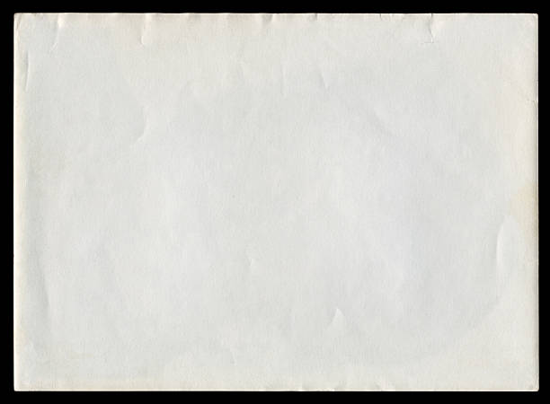 istock Blank white paper page isolated on black background  (clipping path included) 2234700733