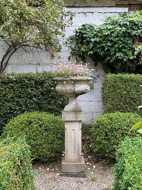 istock Stone Urn On A Pedestal With Flowers, Denmark 2234701696