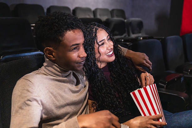 istock Young adults enjoying a movie together 2234701969