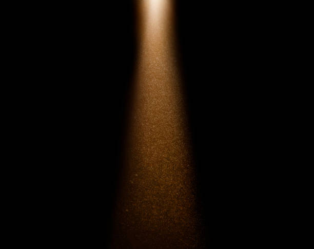 istock Golden light beam illuminating dust particles in dark room 2234707947