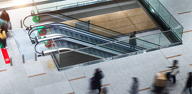 istock Group of people using airport escalators 2234708485
