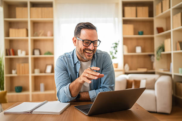 istock Focused businessman working from home having video call on laptop 2234709886