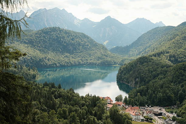 istock lake in the mountains, village, reflection 2234712471