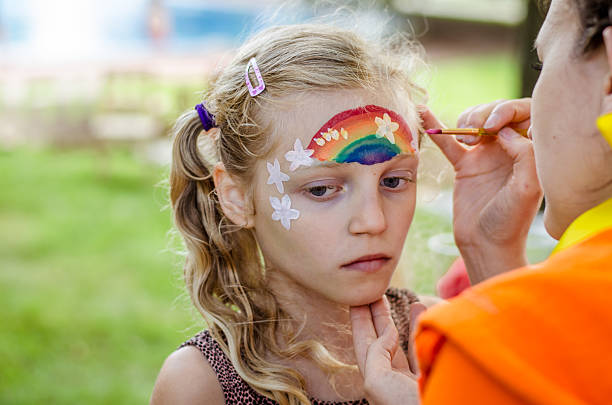 istock colorful summer rainbow face painting 2234712827