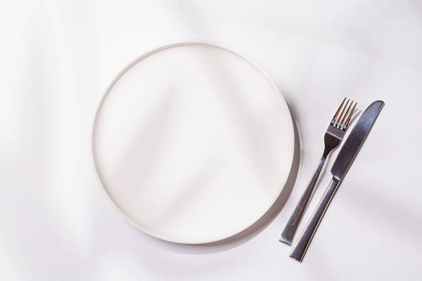 istock Empty plate on white background, food mockup with natural light 2234714300
