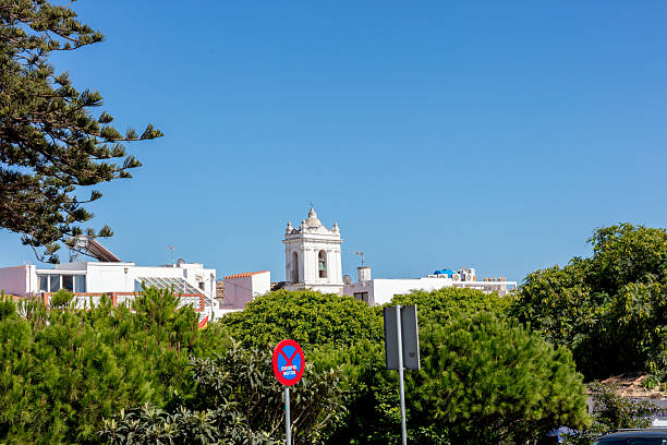View of Tarifa beach with modern apartment buildings and coastal structures under a clear blue sky. Tarifa. Spain. September 2025. High quality photo