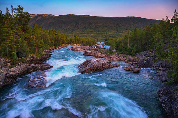 istock Pollfoss Waterfall on the Framruste Rive at Sunset near Billingdalen, Norway 2234715672