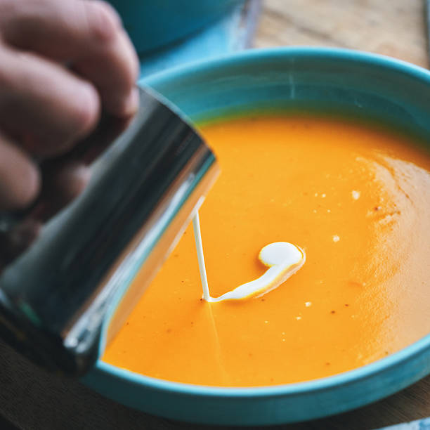 istock Preparing Butternut Pumpkin Soup with Cream and Roasted Pumpkin Seeds 2234717453