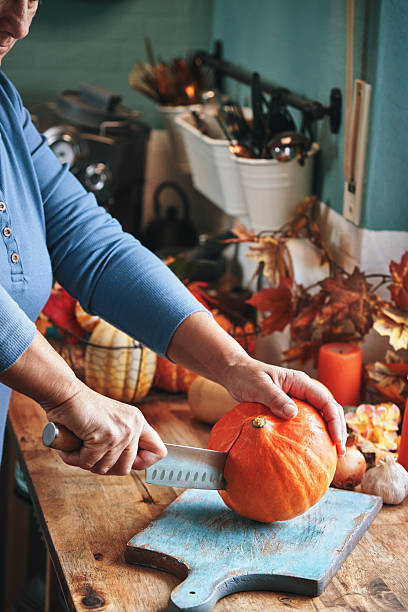 istock Cutting Butternut Pumpkin on Wooden Board 2234717807