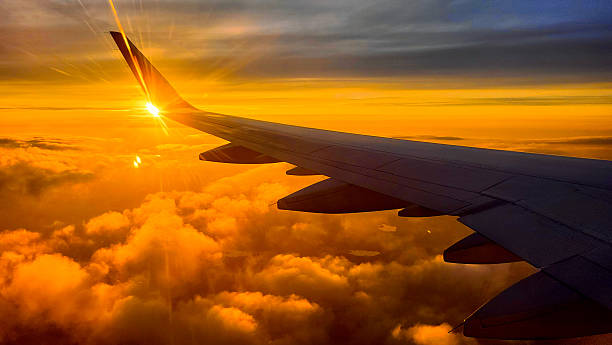 istock View of the cloudy horizon from an airplane window during sunset 2234722761