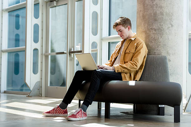 istock Young Man Using Laptop, Casual, Modern Office Space 2234726153