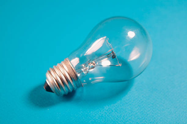 Light bulb on a blue background. The concept of creativity and innovation.