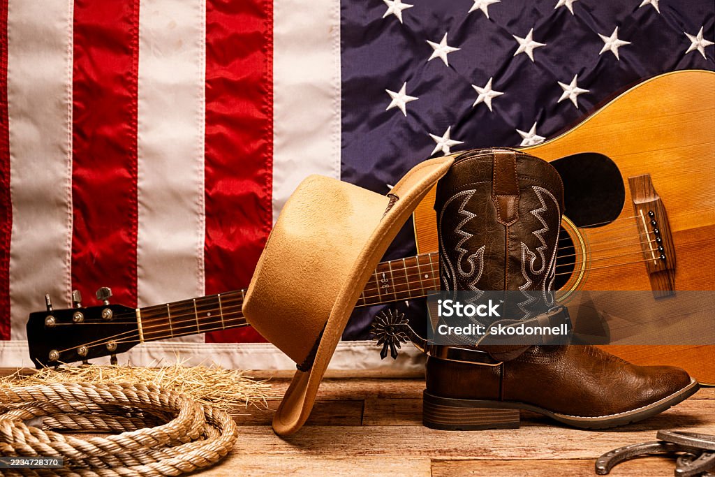 American Flag with Cowboy Hat, Guitar, Horseshoes, and rope - Royalty-free Amerikaanse vlag Stockfoto American Flag with Cowboy Hat, Guitar, Horseshoes, and rope - Royalty-free Amerikaanse vlag Stockfoto