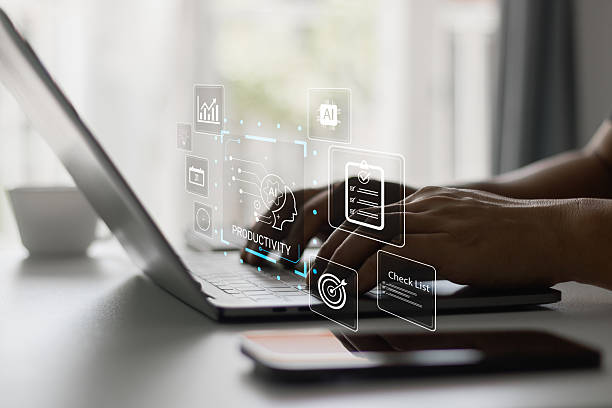 istock Person typing on laptop with digital interface icons showing AI productivity, checklist, data analysis, and task management tools for efficiency, business innovation and smart technology. 2234742784
