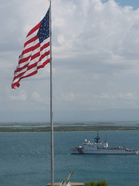 istock Honor at Sea: American Flag Over Naval Power 2234743104