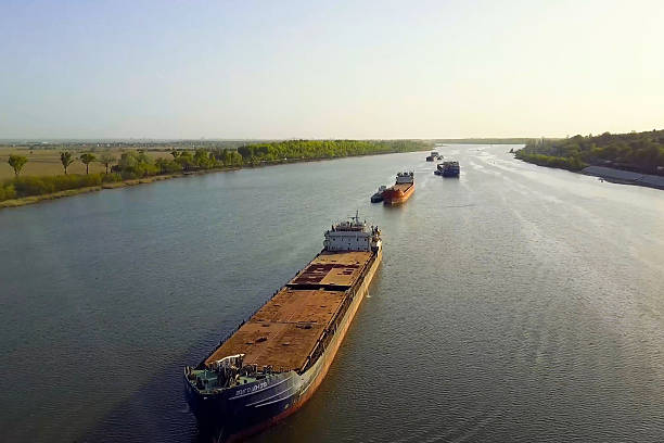 A cargo barge floats along the river. Cargo ship
