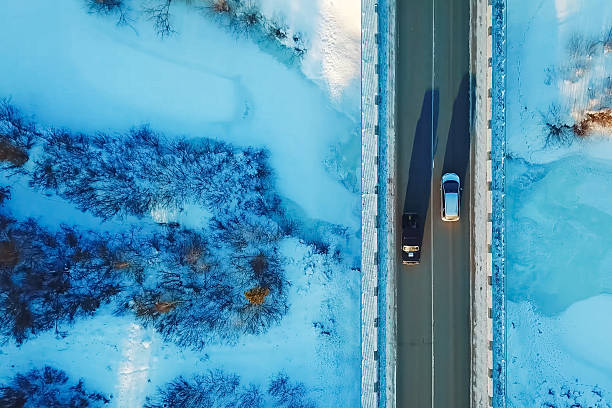 istock Car rides on a bridge over ravine, view from above. 2234750867