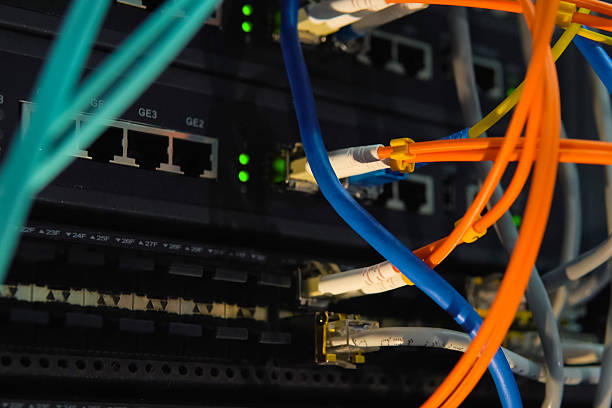 istock working server. Internet wires and flashing lights on the server. 2234750891