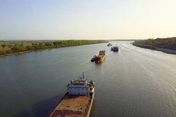 istock A cargo barge floats along the river. Cargo ship. 2234750915