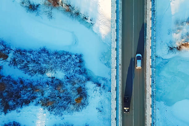 istock Car rides on a bridge over ravine, view from above. 2234750927
