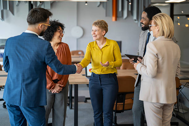 istock Business people shaking hands in modern office 2234756092