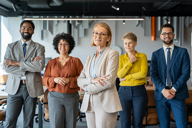 istock Confident business team smiling at the camera in their office 2234756111
