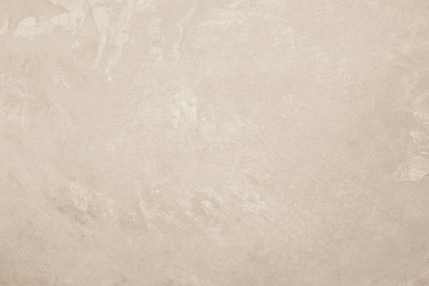 istock Colour old concrete wall texture background. Close up retro plain cream color cement wall background texture. 2234756248
