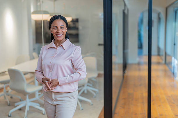 istock Confident businesswoman smiling in modern office 2234756507