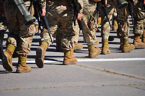 istock Boots of uniformed soldiers in a row 2234760751