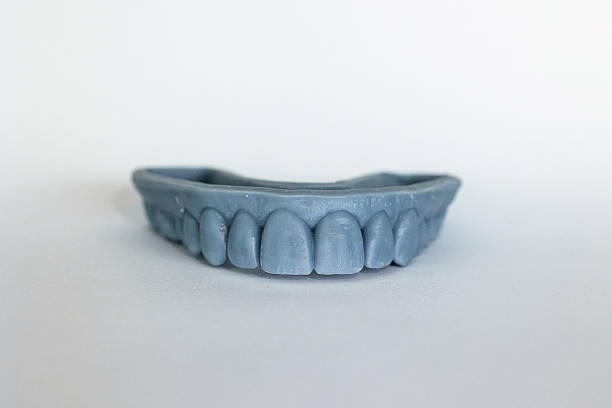 istock Blue 3D printed dental model isolated on white 2234765705