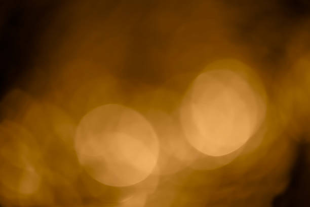 istock Classic vintage brown sepia gradient  with soft light blurred bokeh effects wallpaper background. 2234774552