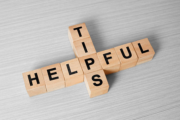 istock Helpful tips concept on business workplace collected of woodens cubes puzzle 2234785332