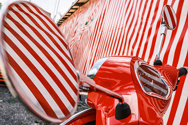 Munich, Germany - August 18:typical italian Vespa Motorscooter (build from Piaggio) at a street in munich on August 18, 2025