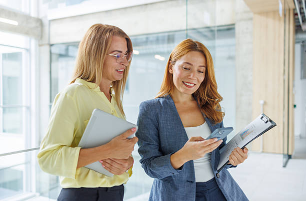 istock Businesswomen collaborating and discussing work in office 2234792134