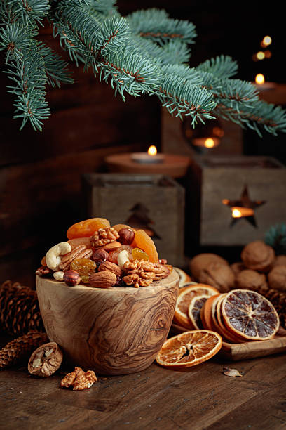 istock Dried fruits and nuts on an old wooden table. 2234796086