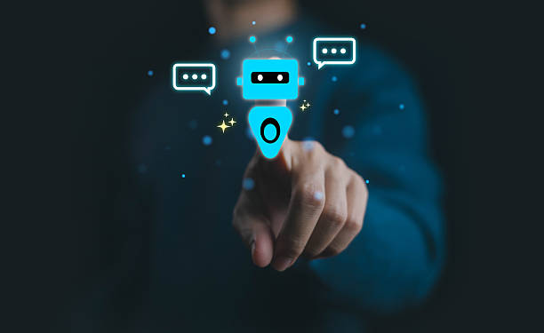 istock Futuristic concept of chatbot technology with artificial intelligence and digital communication, showing a human hand interacting with virtual robot assistant and speech bubbles. 2234800243