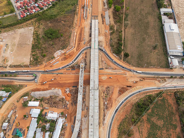 istock The construction site before the construction of the concrete bridge over the intersection by crane workers, tractors, and backhoes 2234801916