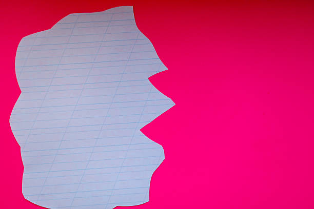 istock ​A torn sheet of notebook paper on a pink background, creating an interesting contrast between two textures and colors. This image can symbolize creativity, new ideas, or the need to start with a blank slate. 2234802452