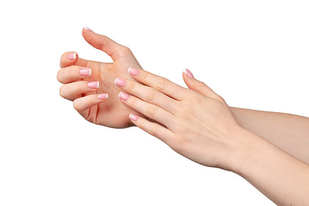 istock Well-groomed female hands with manicure on white background 2234804956