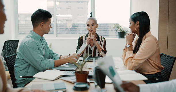istock Creative, team or meeting with paperwork in office for manuscript revision, writing advice or ideas. Publishing agency, journalist staff or people with feedback for story development or review topics 2234806000