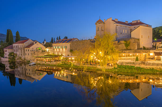 istock Majestic sunset over Trebinje's historic architecture by the tranquil river 2234807252