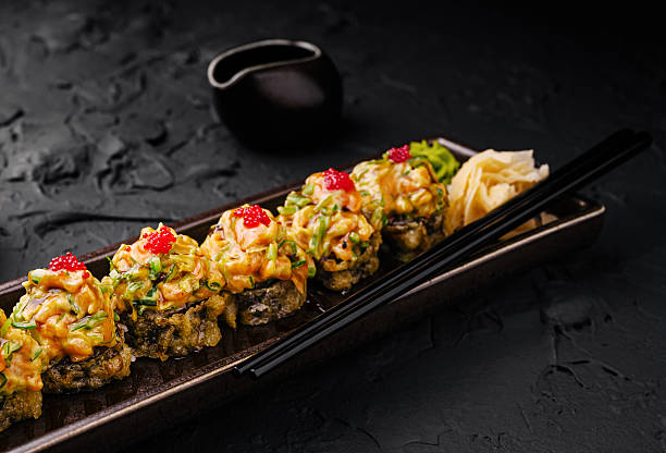 istock Sushi platter with colorful toppings served on a dark stone background 2234810299